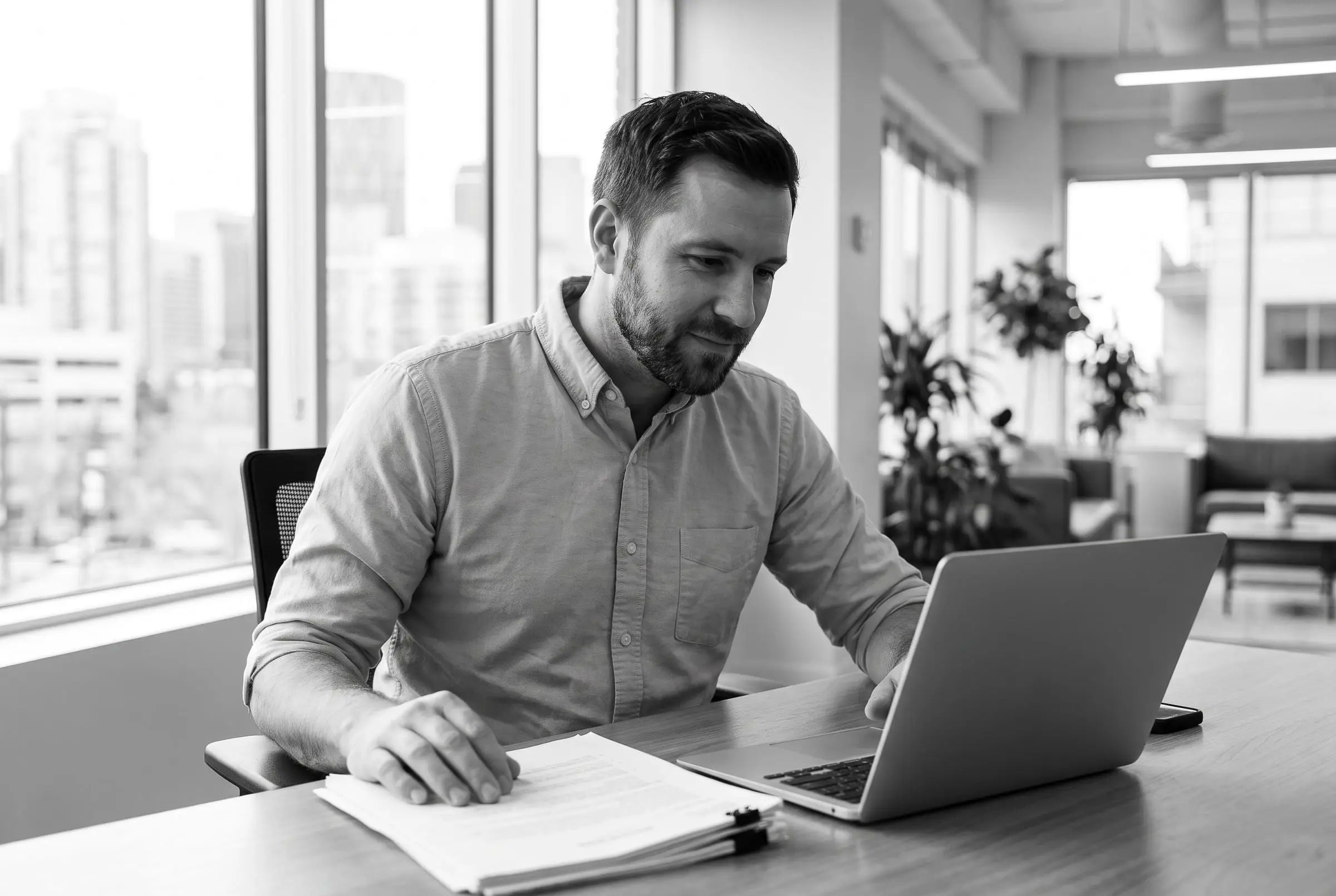 Rafael Costa working through a client’s figures at his desk