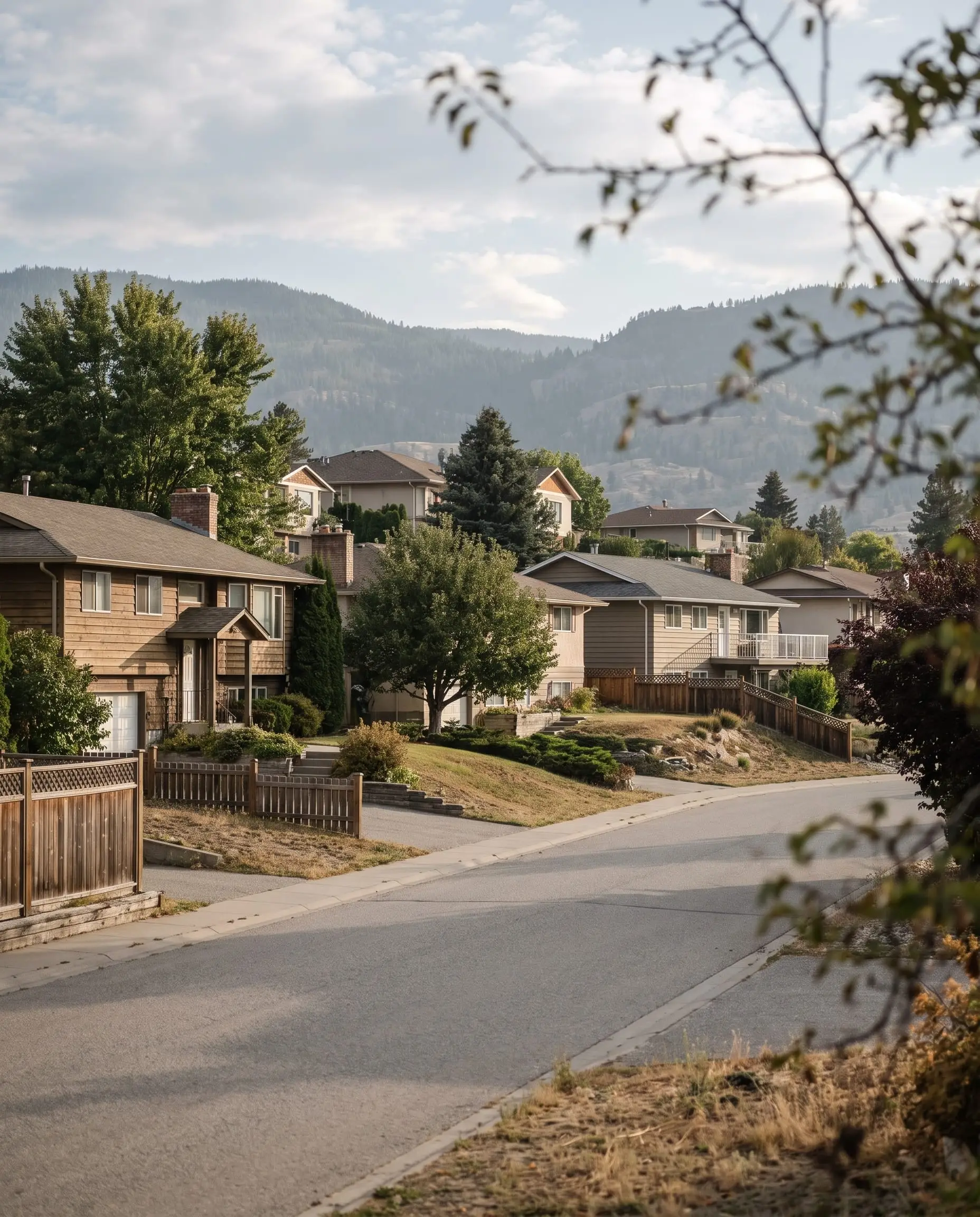 A residential street in Glenmore with the hills behind